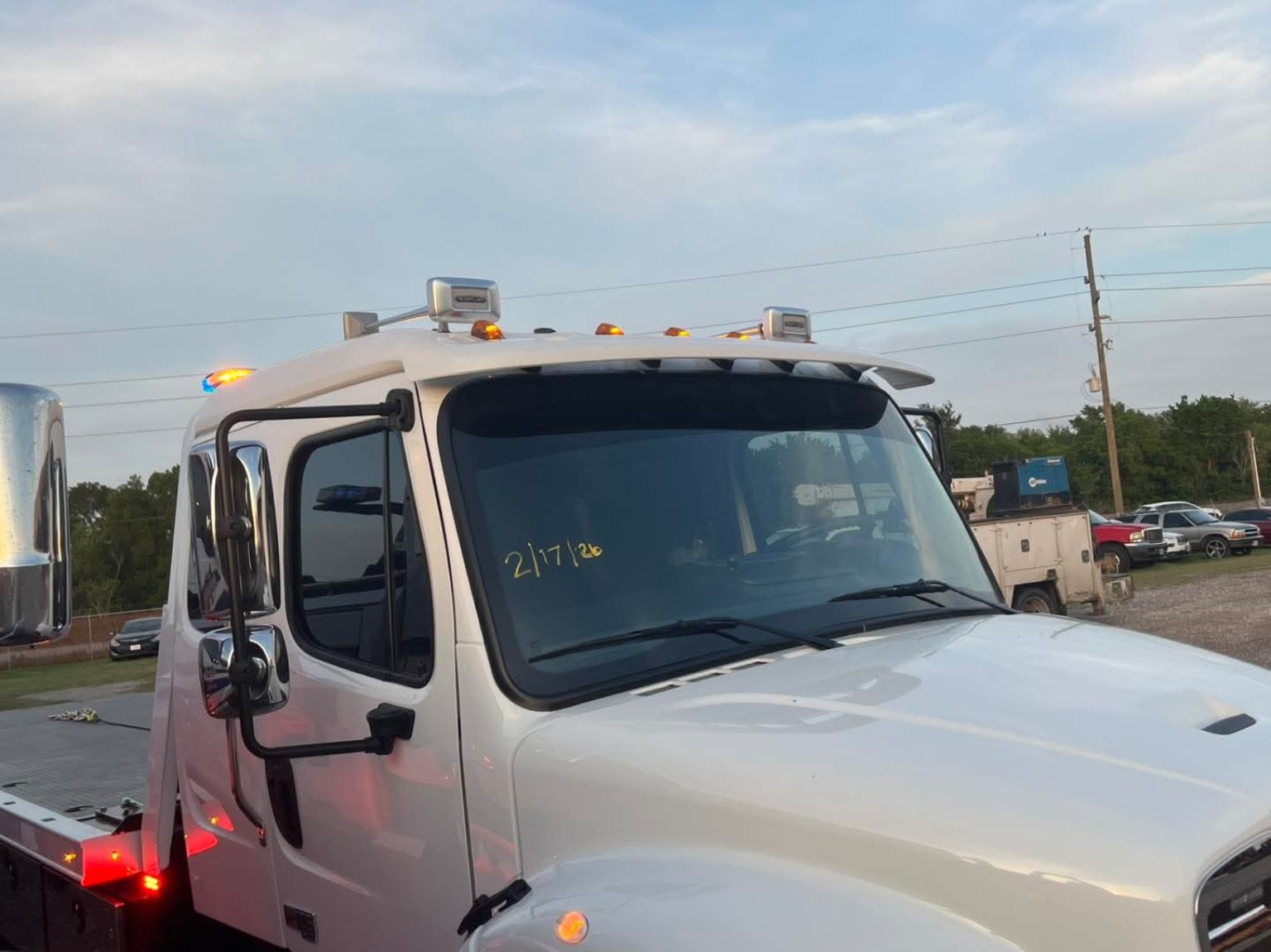 White tow truck with tinted windows